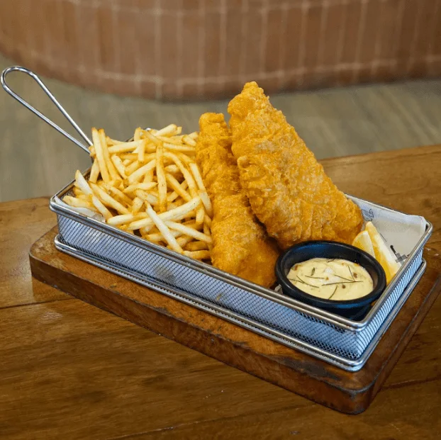 Two pieces of fried meat with extra fries,  a menu of blakes and stings philippines resturant.