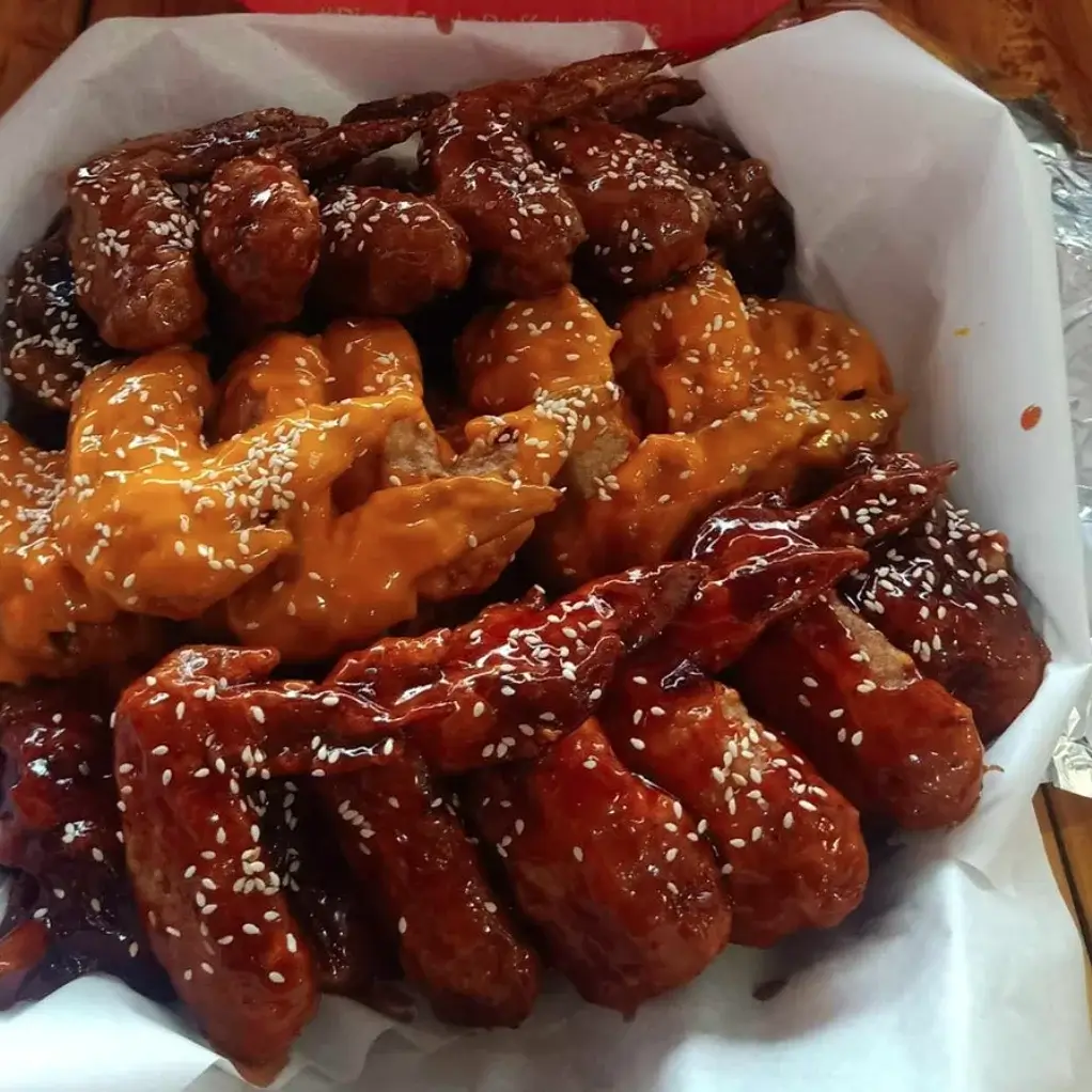 Wings with ketchup on top, a menu of master buffalo philippines resturant.