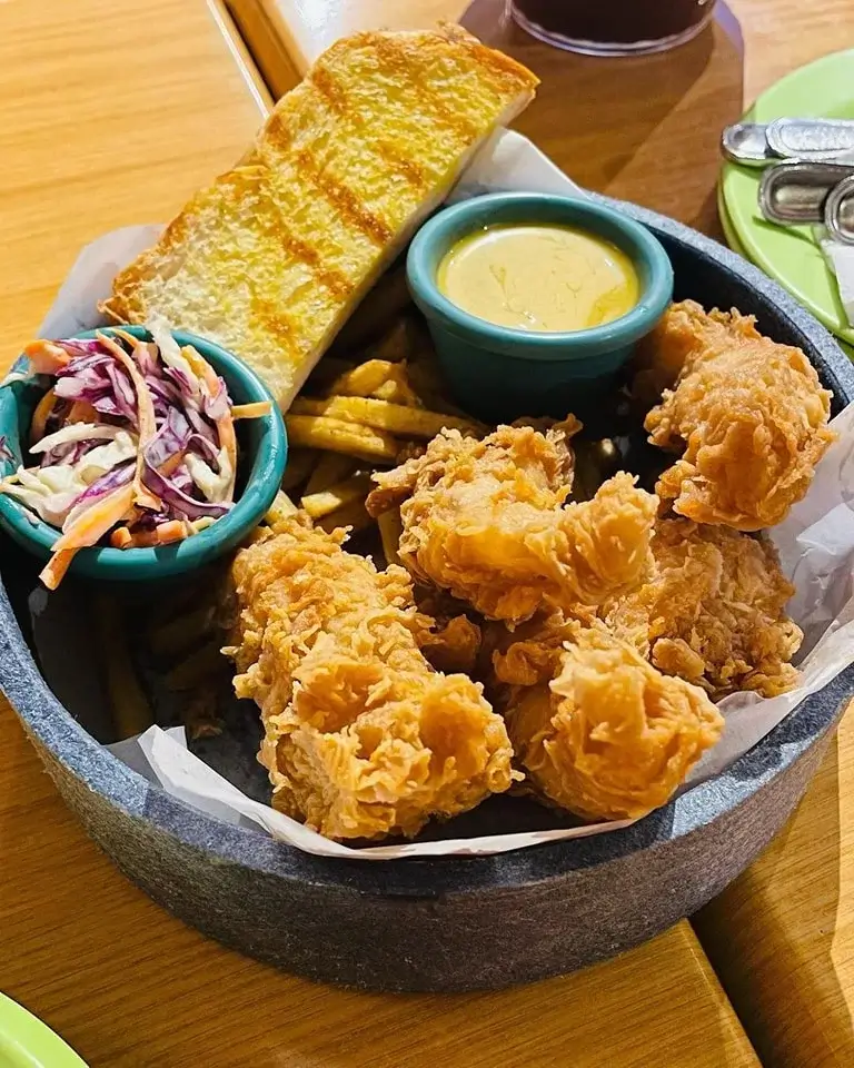 Fried Chicken with fries and salad, a menu of Casa Verde Philippines resturant.